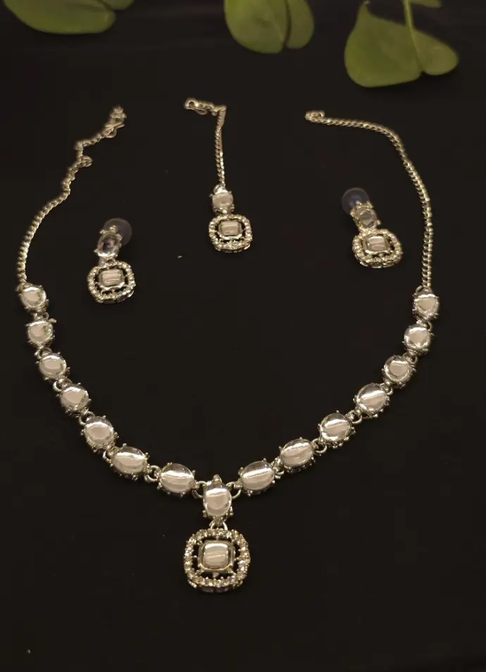 silver necklace and earrings