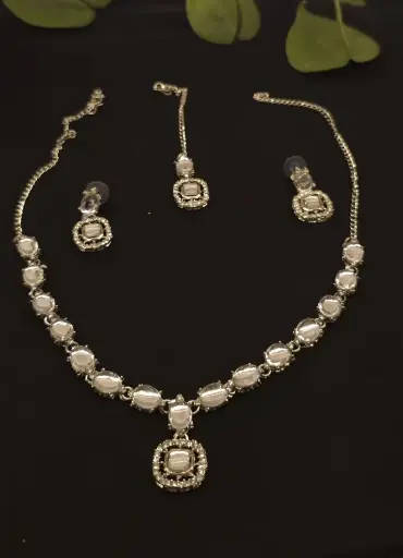 silver necklace and earrings